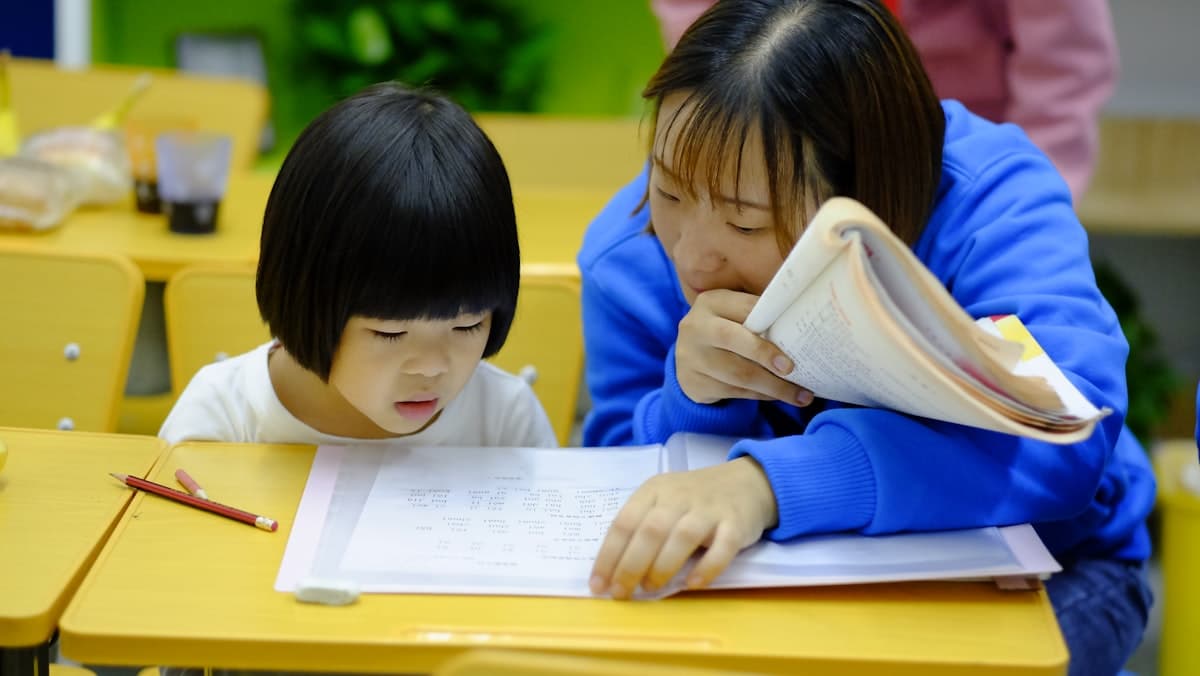 Children reading together in the library